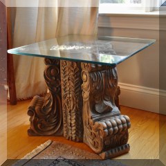 F19. Pair of carved wood pedestal tables with glass tops. 16”h - $150 each